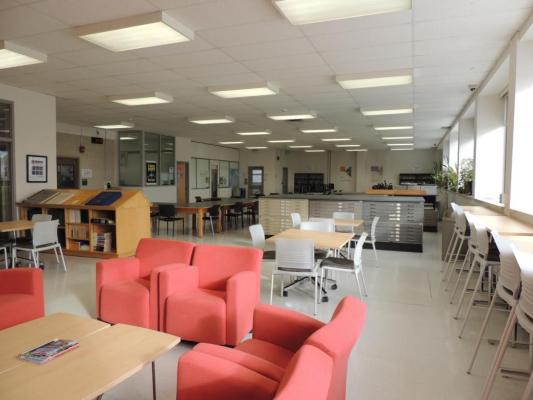 Part of GRC. Comfy chairs. Row of chairs and desks near windows. Please come in.