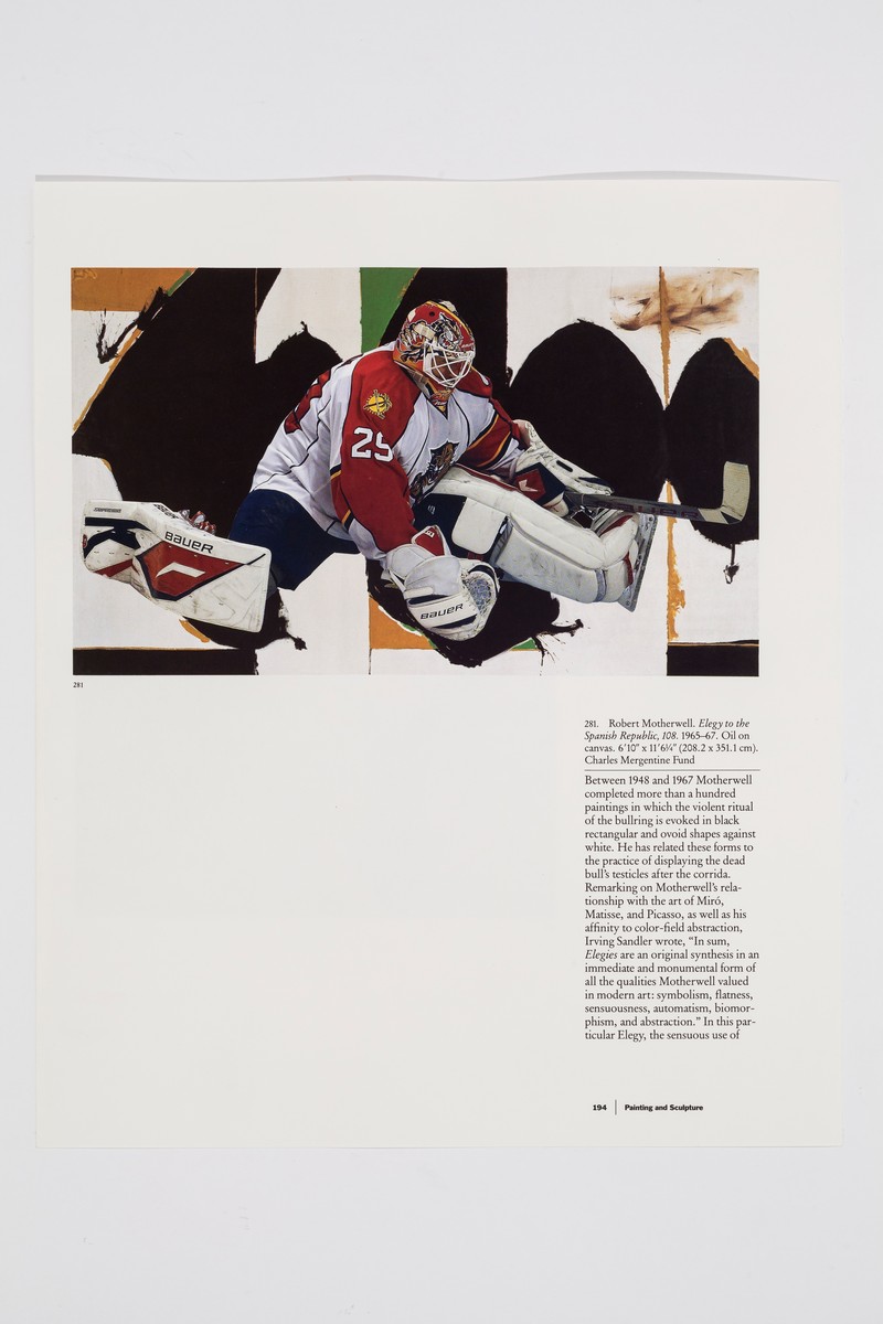 Close-up photo of the image on the far left of the display. The hockey image takes up the top third of the page, showing goalie Mike Vernon wearing a white and red jersey. His legs are splayed out to the sides and his stick is outstretched in his left hand to defend the goal. His image is collaged overtop a reproduction of Robert Motherwell’s painting entitled Elegy to the Spanish Republic from 1965-1967. Below, on the far right side of the image is a text column that describes Motherwell’s painting.