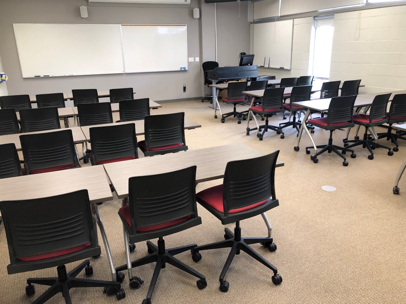 The instruction room has about 7 tables and chairs. Both chairs and tables are on rollers.
