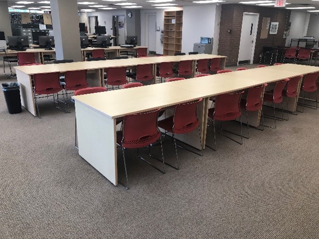 Long table with eight chairs on either side