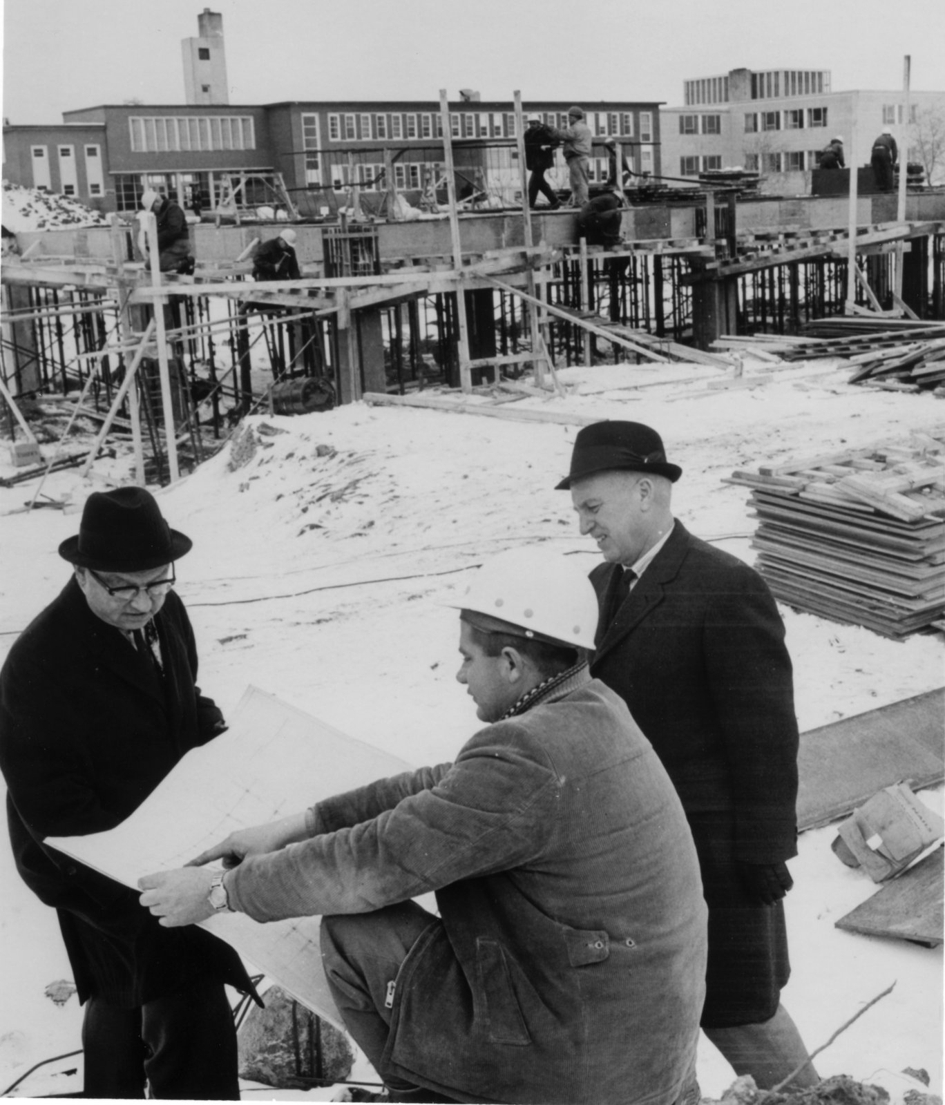 Library staff and construction workers at the library