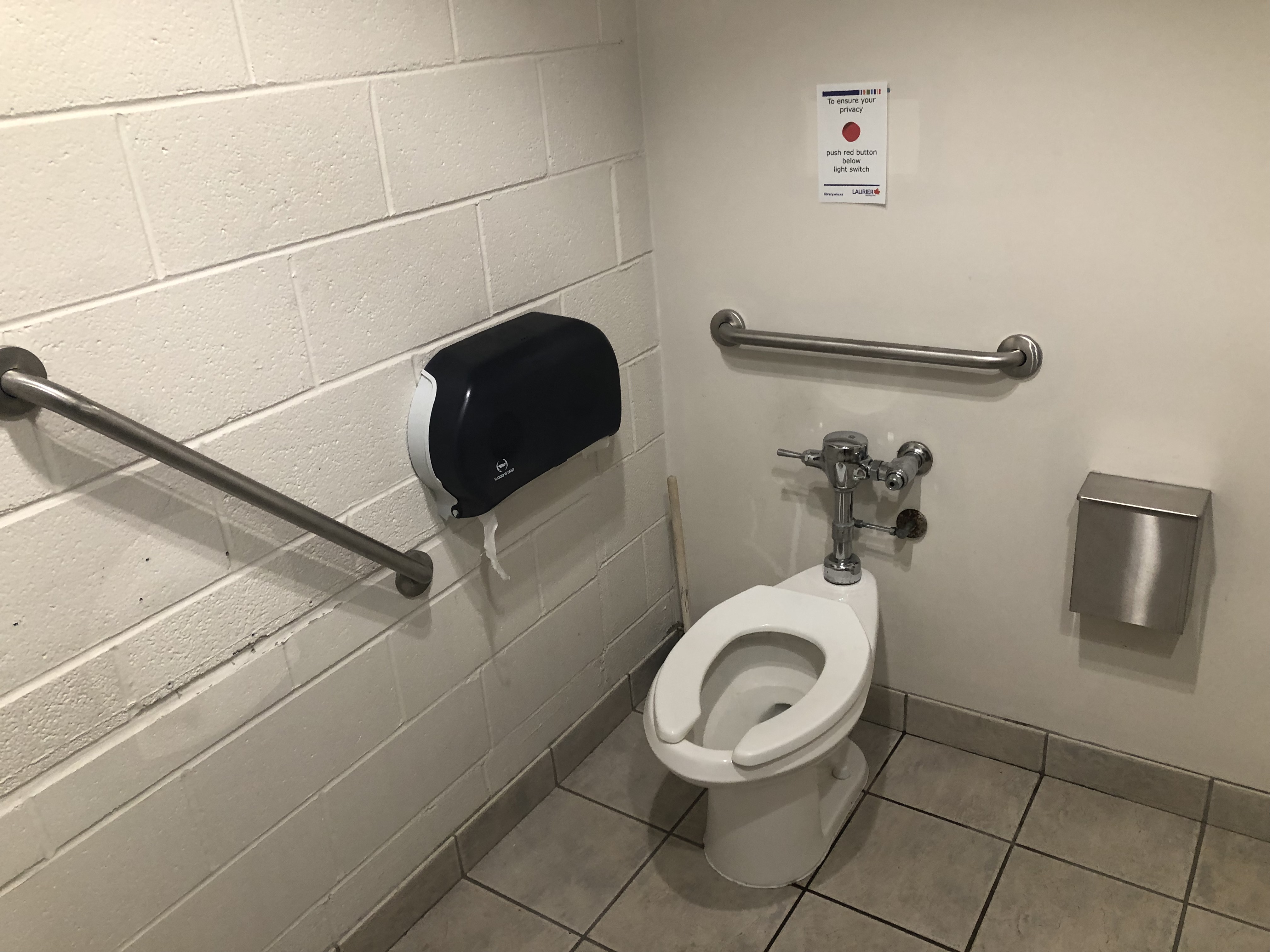 Single-user washroom, grab bars, flush handle at back