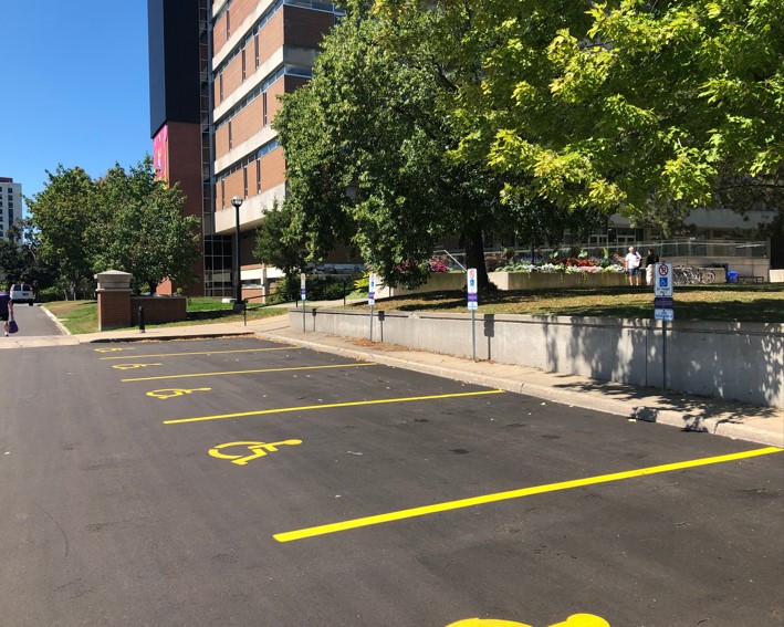Several accessible parking spots outside library