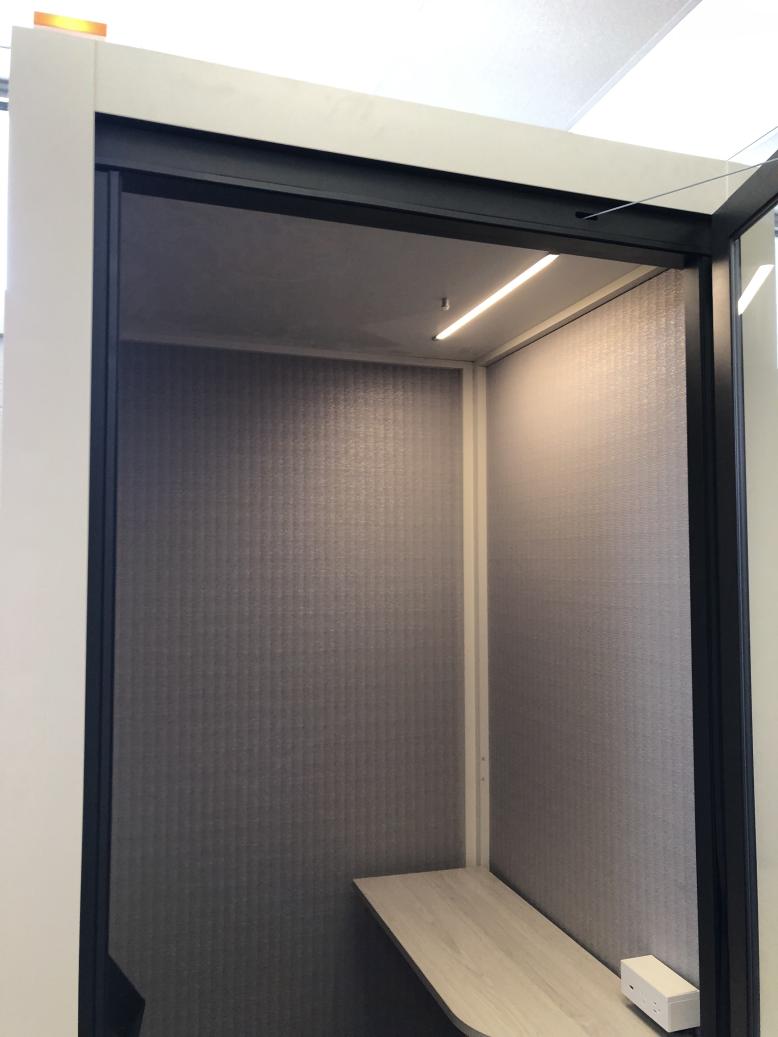 Interior of a pod with door open. A shelf and light above. Description of pods follows at heading 2
