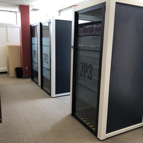 Study pods are enclosed spaces, like a phone booth. It seats one person and there is a surface for a laptop.